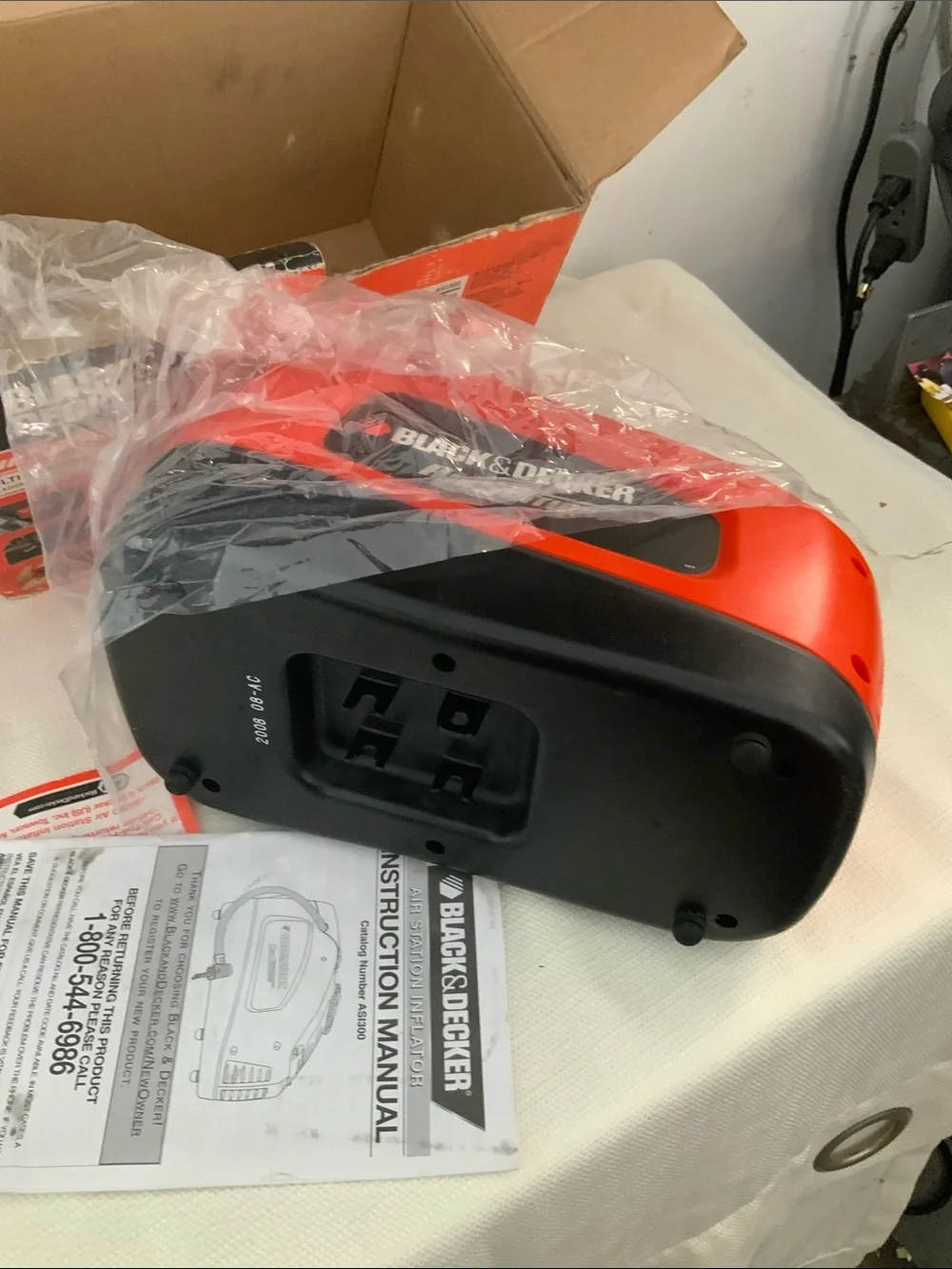 Black & Decker tire inflator. Manual included.
